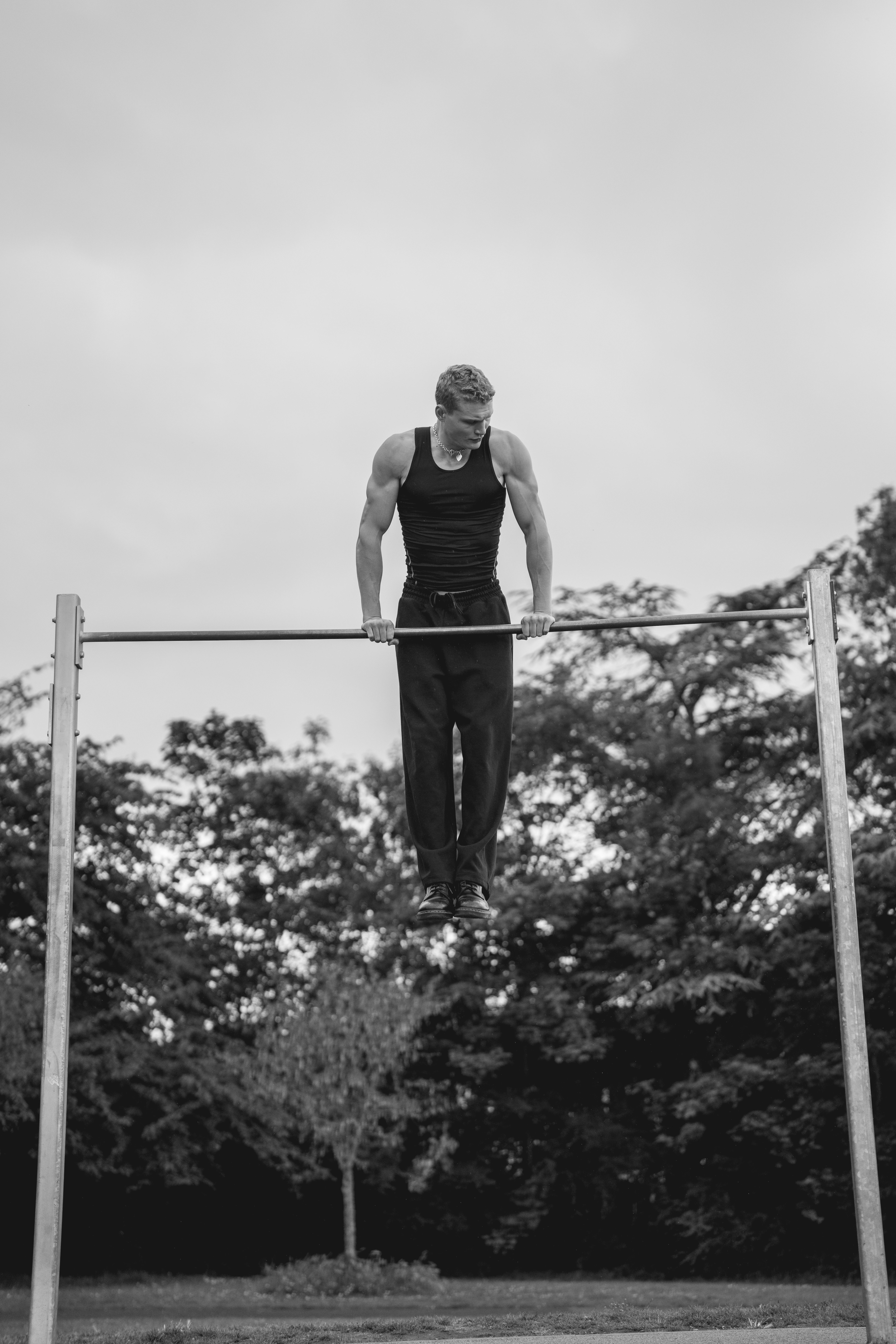Athlete training at a calisthenics park